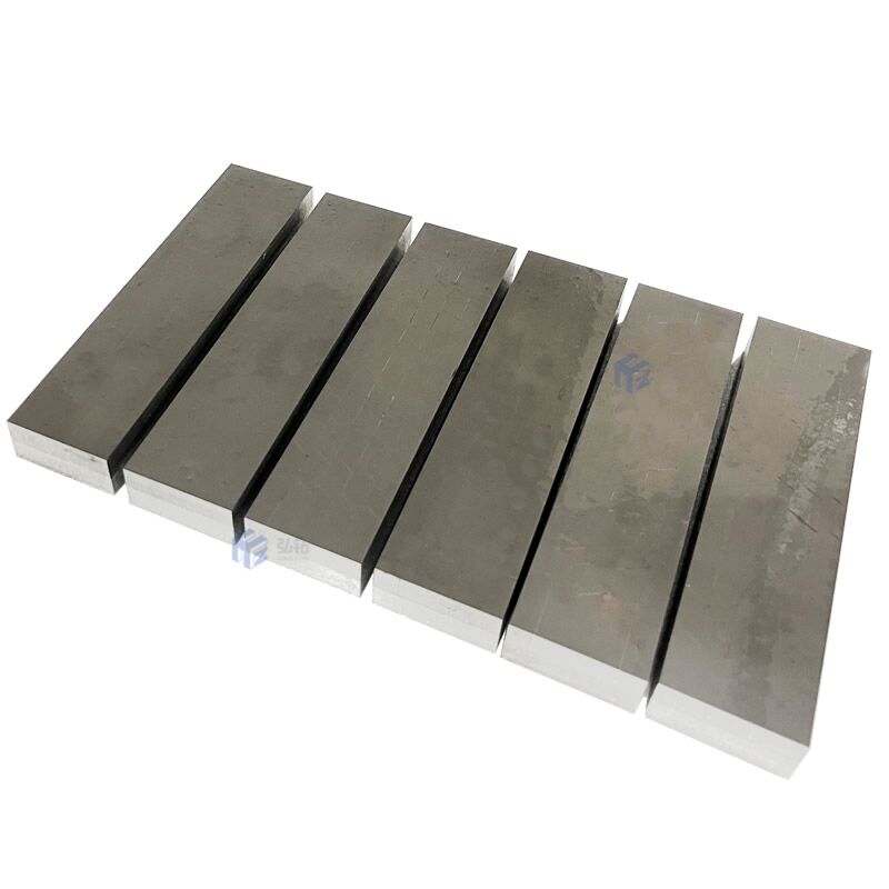 Hardmetal tips brazed wear resistant plate.