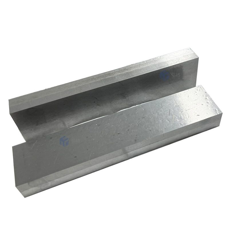 Hardmetal tips brazed wear resistant plate.