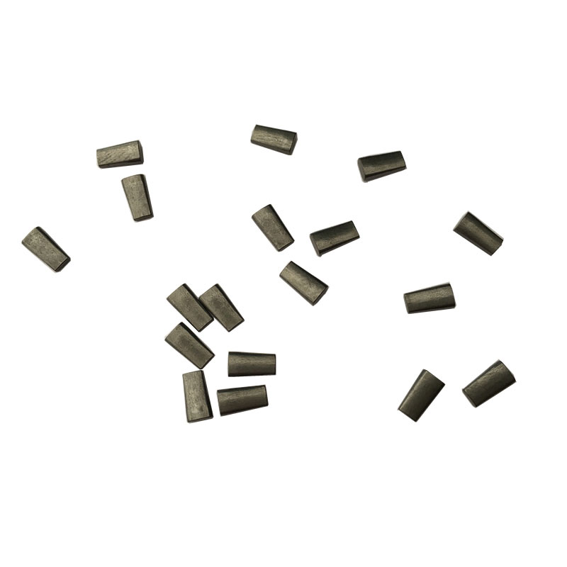 Tungsten carbide pins for tire stud core