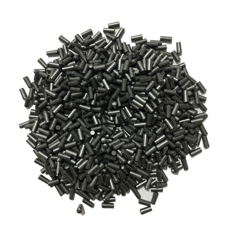 Tungsten carbide pins for tire stud core